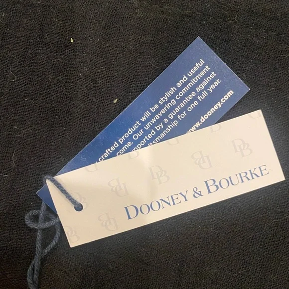 DOONEY & BOURKElarge zip wristlet! Such a pretty plaid with tan leather trim!